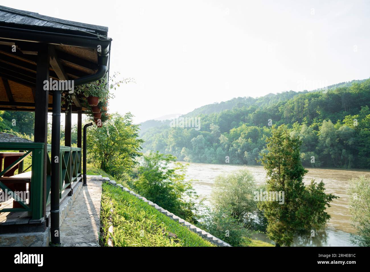 Porch of a wooden house in the forest on the river bank Stock Photo - Alamy