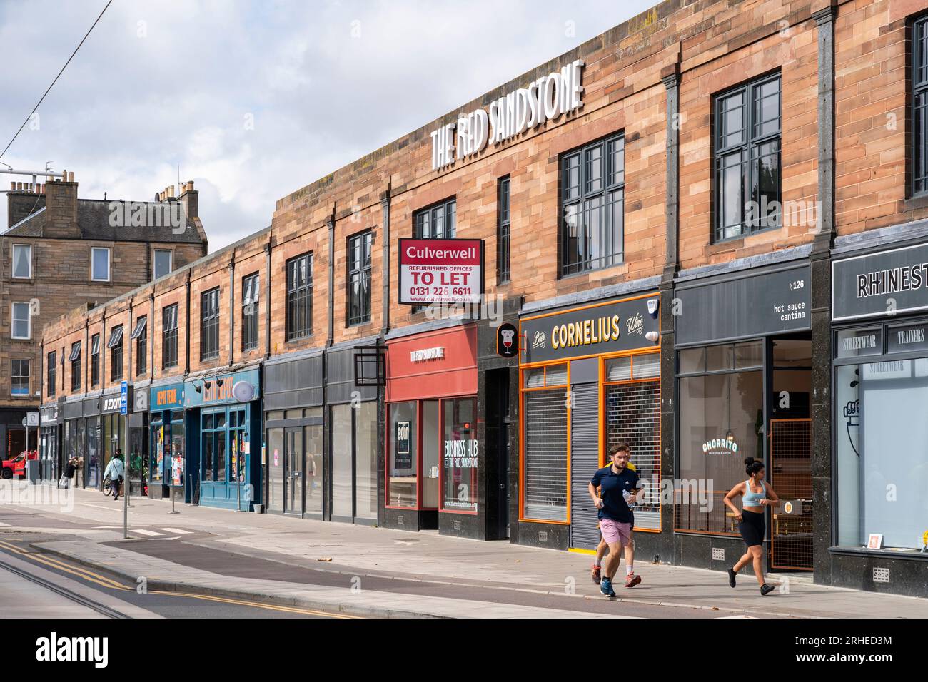 The exterior of The Red Sandstone property with mixed business use on Leith Walk , Leith, Edinburgh, Scotland, UK Stock Photo