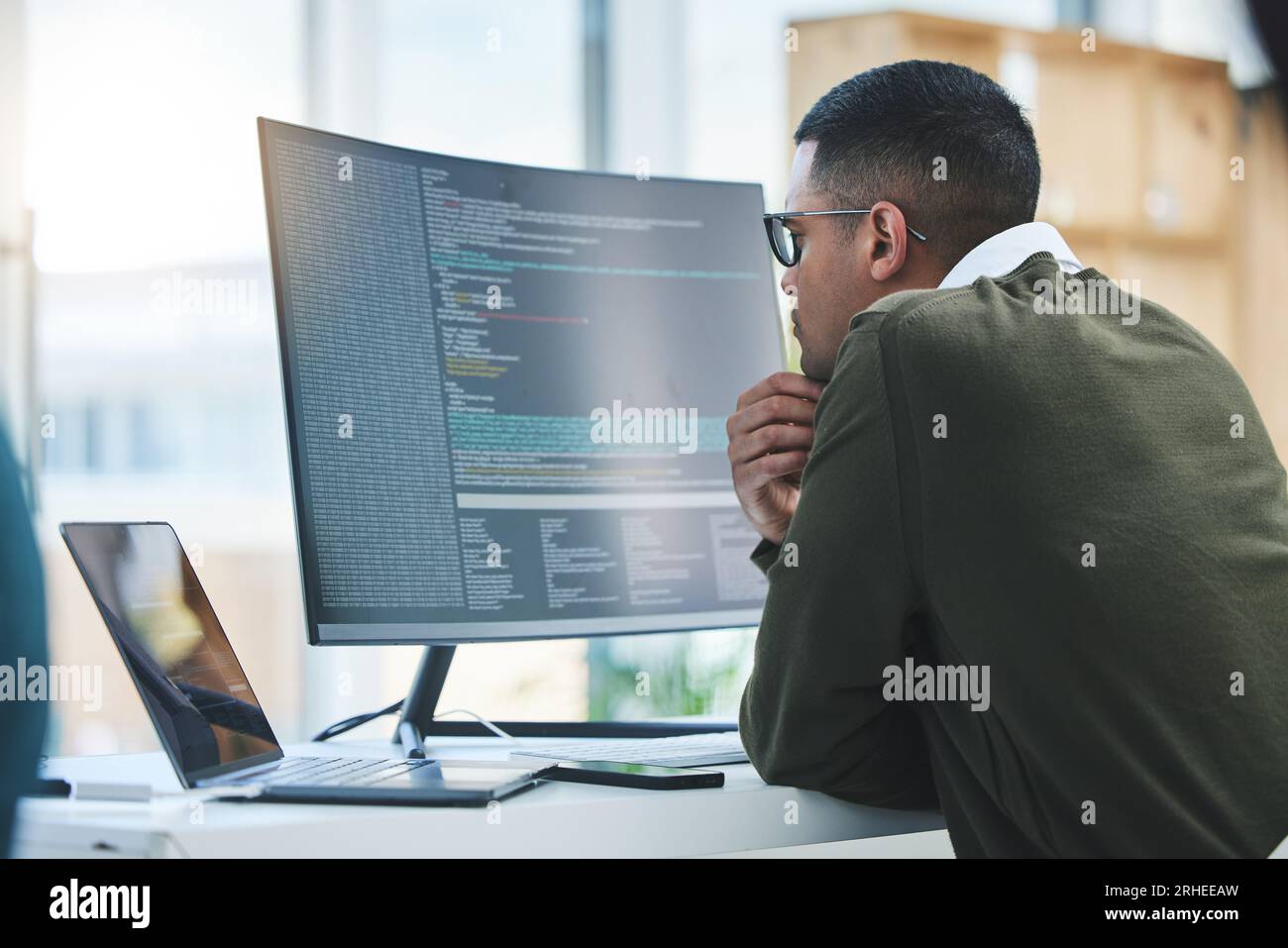 Man, computer screen and thinking of coding, programming or software development and online solution. Programmer or developer reading html script Stock Photo