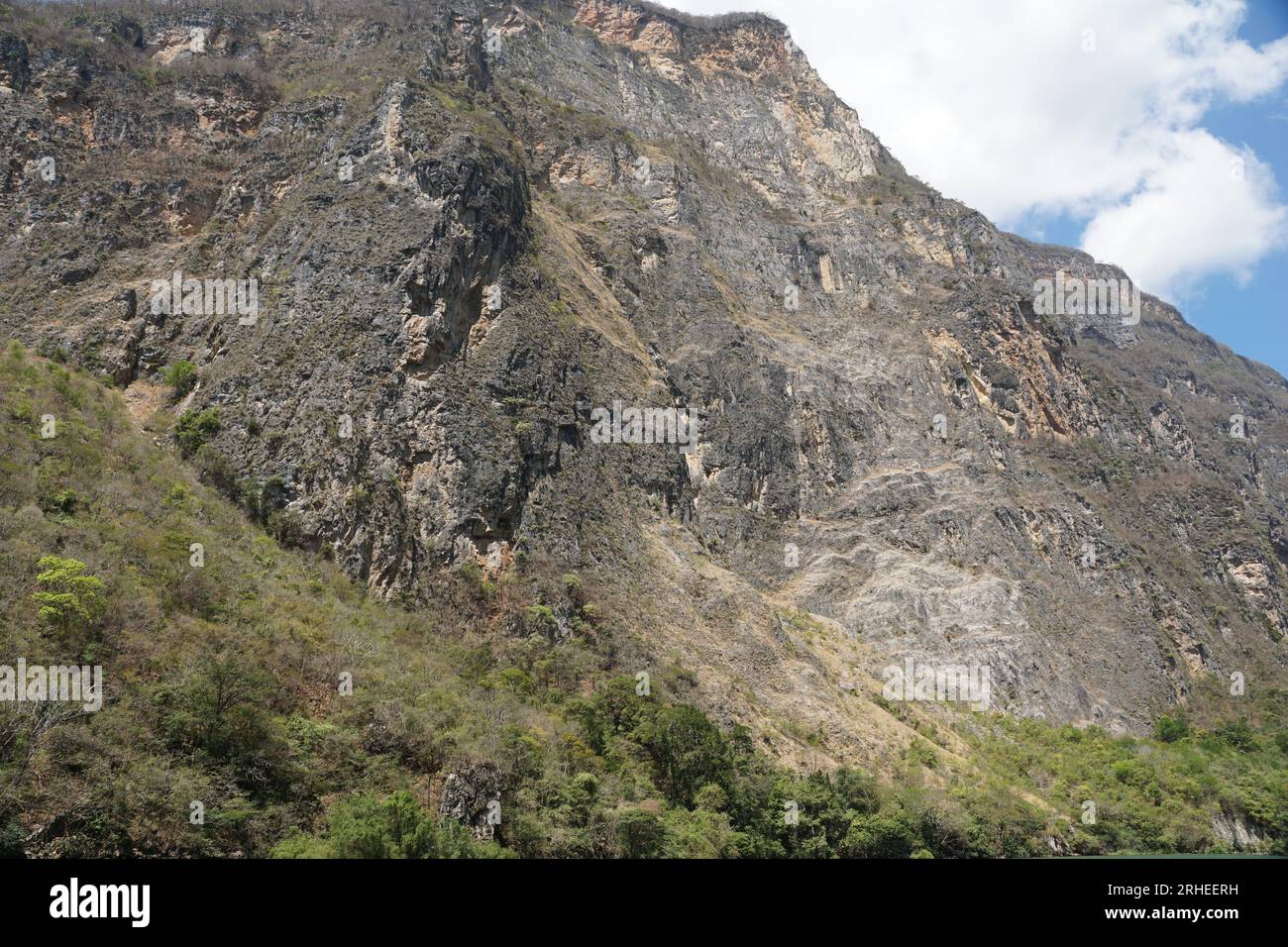 Limestone, sumidero canyon, sky, geology, clouds, trees, vegetation at chiapas, mexico Stock Photo