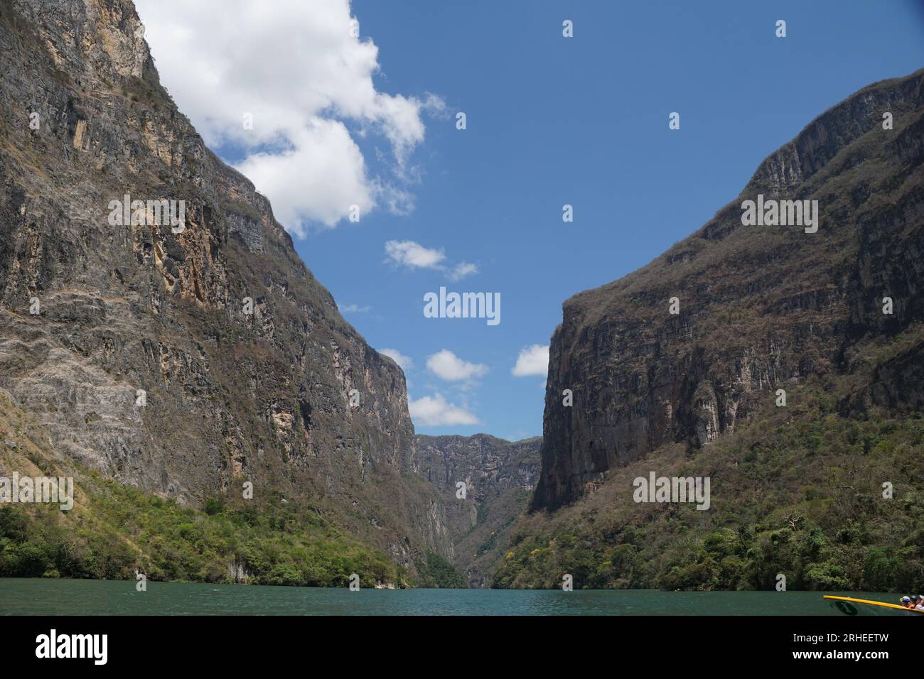 sumidero canyon, sky, clouds, boat, grijalva river, vegetation, trees at chiapas, mexico Stock Photo