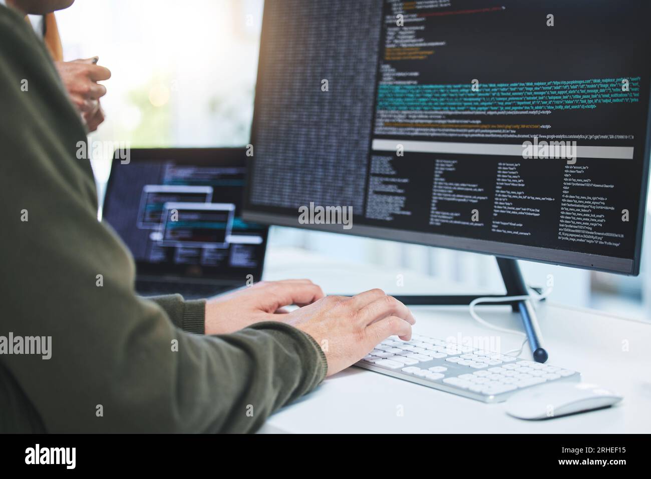 Programming, developer and hands on computer for coding, software script or cyber security in office. Closeup of IT technician person with technology Stock Photo