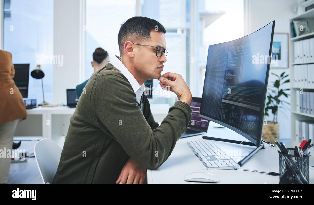 Programmer man, software development and thinking at computer for coding, software script or cyber security. Technician person with technology for Stock Photo