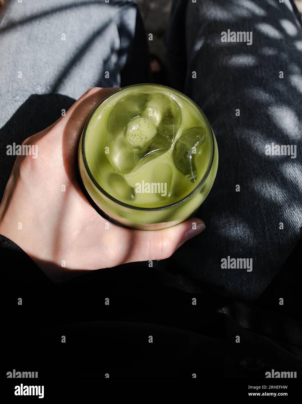 Green tea smoothie, decorate topping with whipping cream in a clear