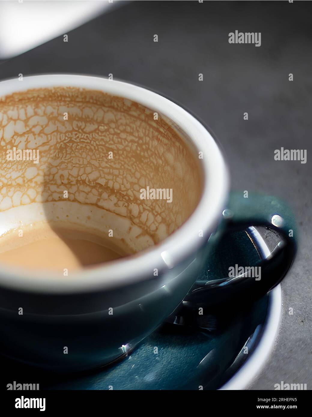 empty coffee cup, patterns on coffee ceramic, on concrete table and green ceramic cup Stock Photo