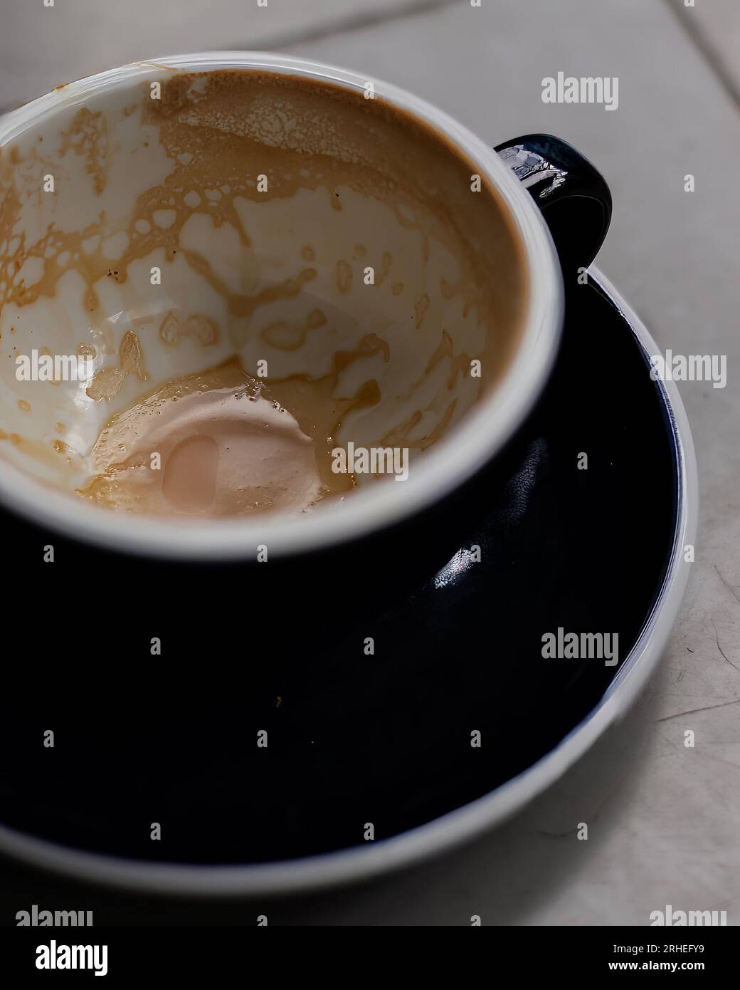 empty coffee cup, patterns on coffee ceramic, on concrete table and green ceramic cup Stock Photo
