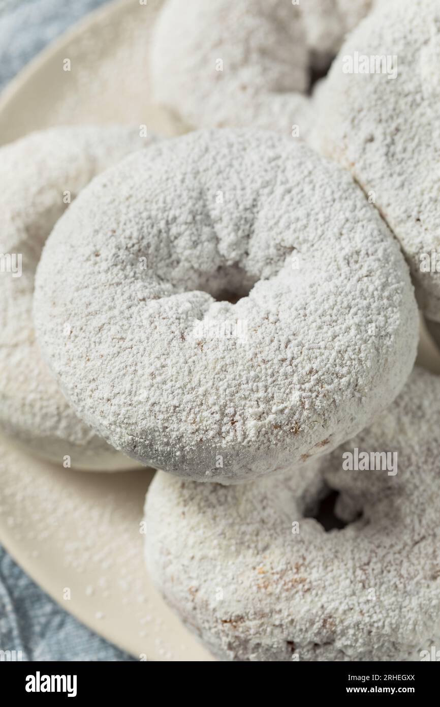 Homemade Sweet Powdered Sugar Donuts for Breakfast Stock Photo