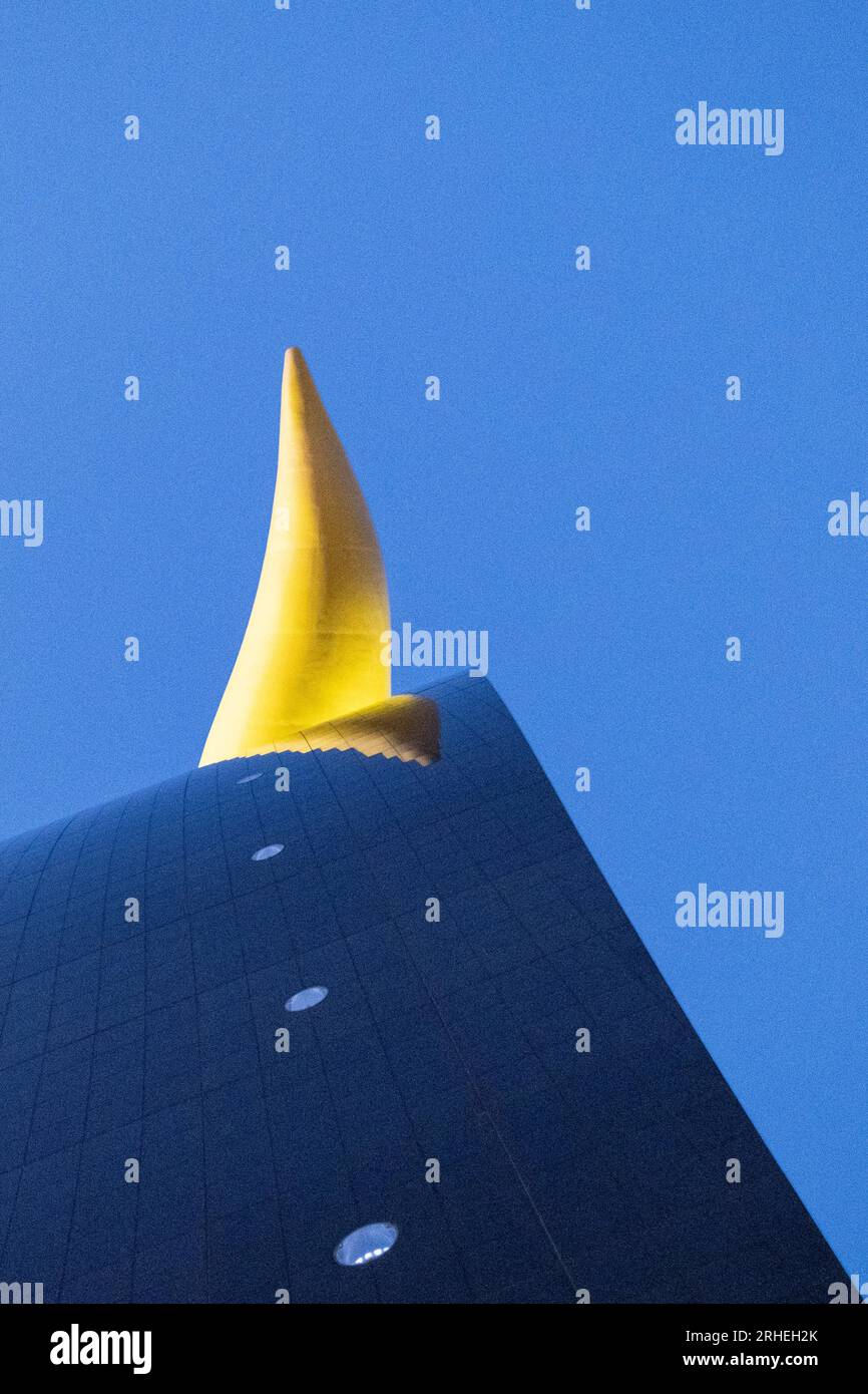 Detail of The Asahi Beer Hall (a.k.a. Super Dry Hall, or Flamme d'Or), viewed from below. Asakusa, Tokyo, Japan, at twilight. Stock Photo