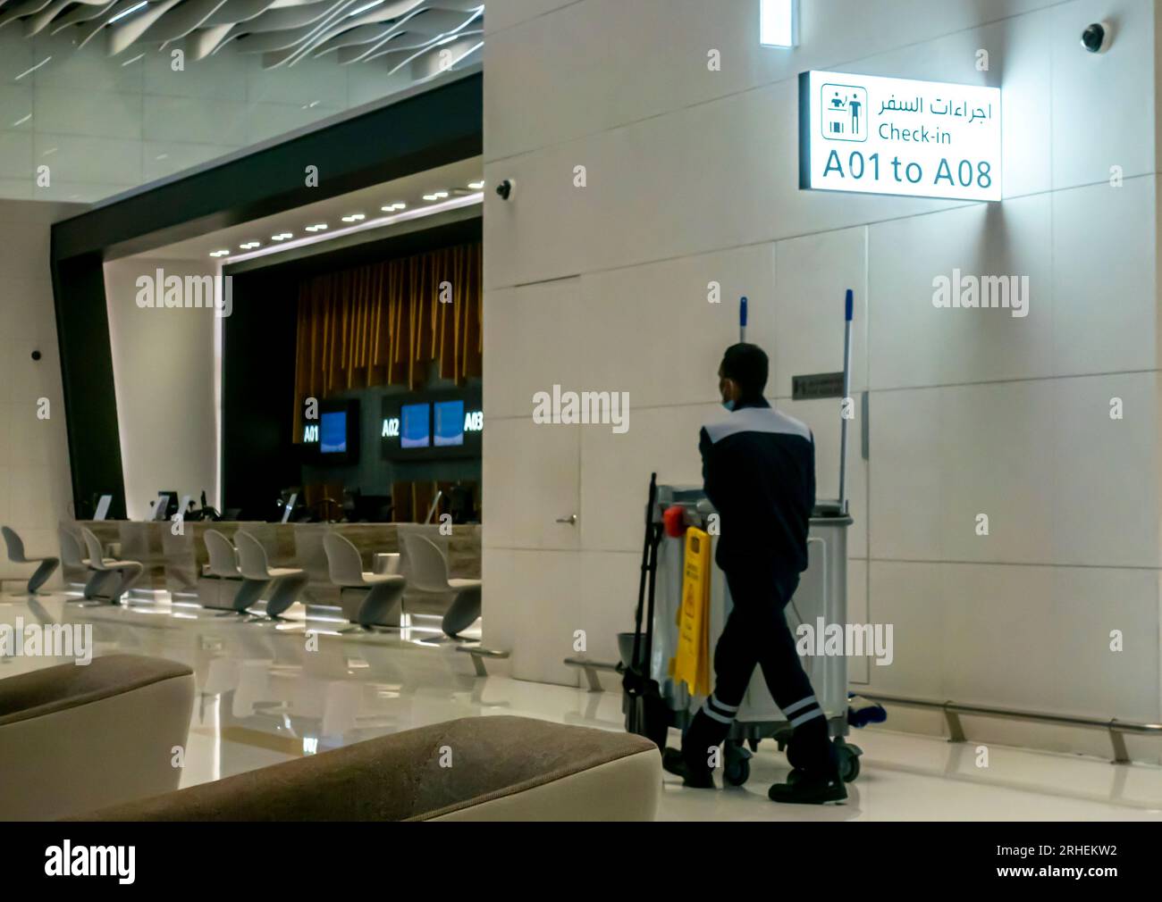 Cleaning personnel Bahrain airport. Bahrain airport cleaner. Employee in airport Bahrain Stock Photo