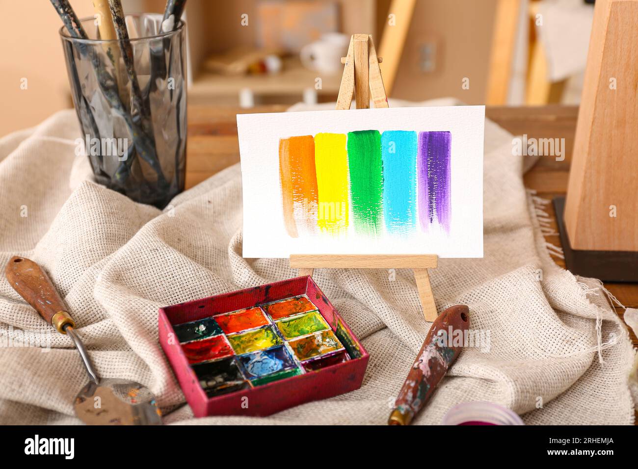 Mini easel with paints strokes in artist's studio Stock Photo
