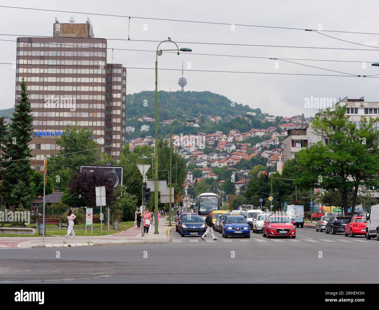 Street known as Sniper Alley during Bosnian War with TV aka Broadcasting Tower on hill. Sarajevo, Bosnia and Herzegovina, August 16,2023.. Stock Photo