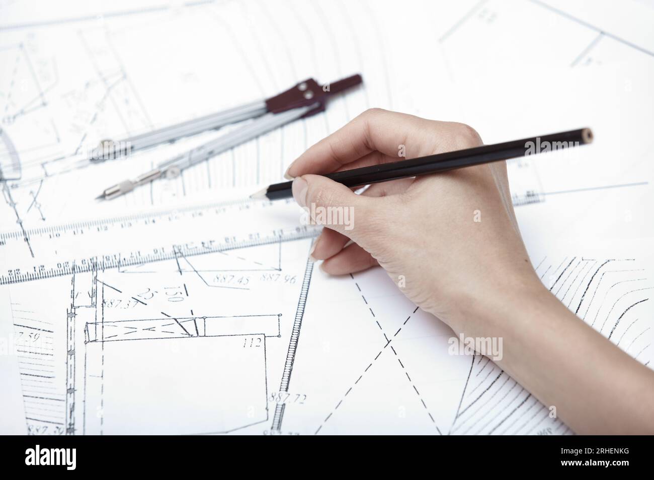 Hands of engineer working on a construction plan Stock Photo