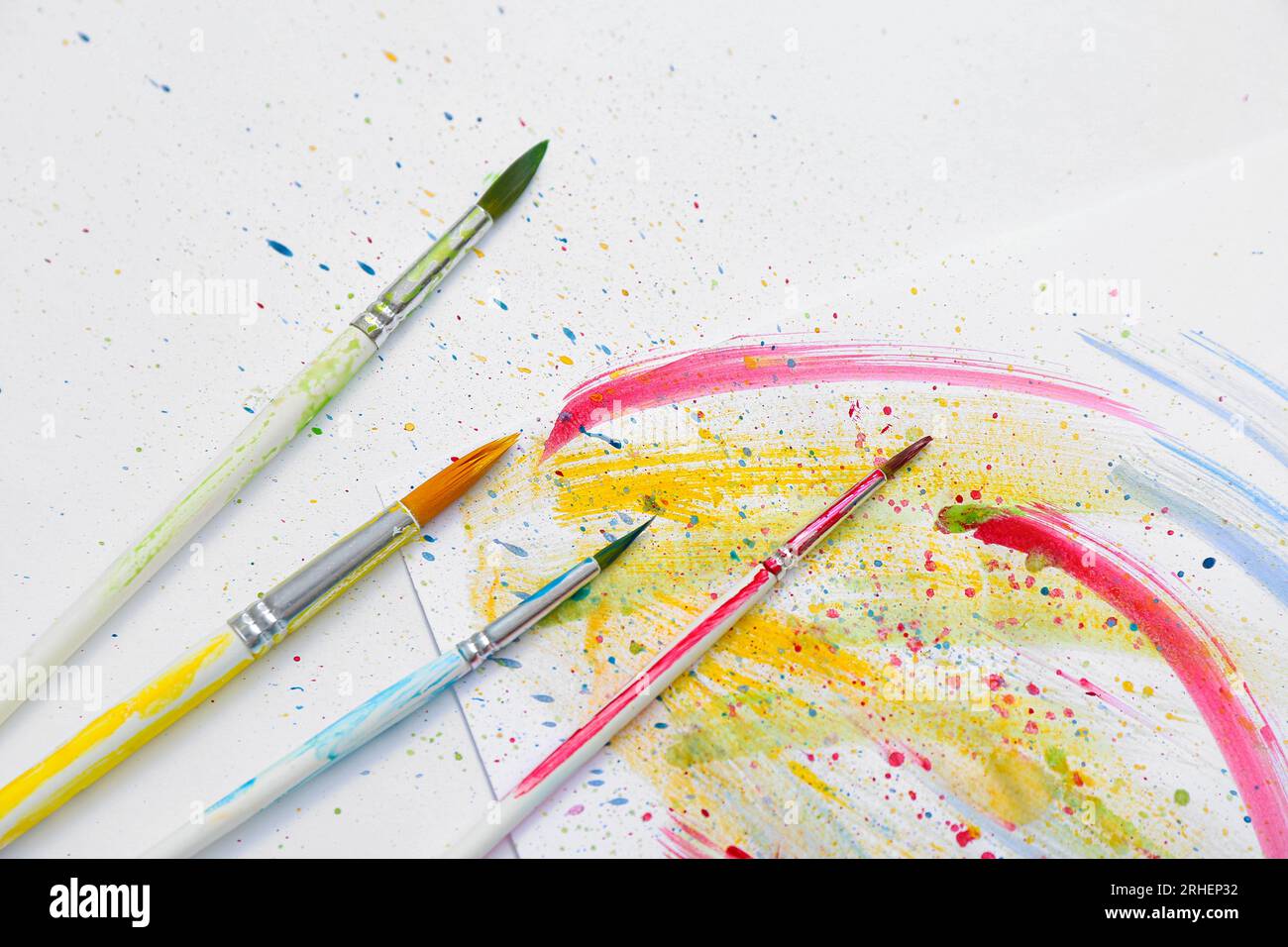 Artist's brushes with paints on white background Stock Photo