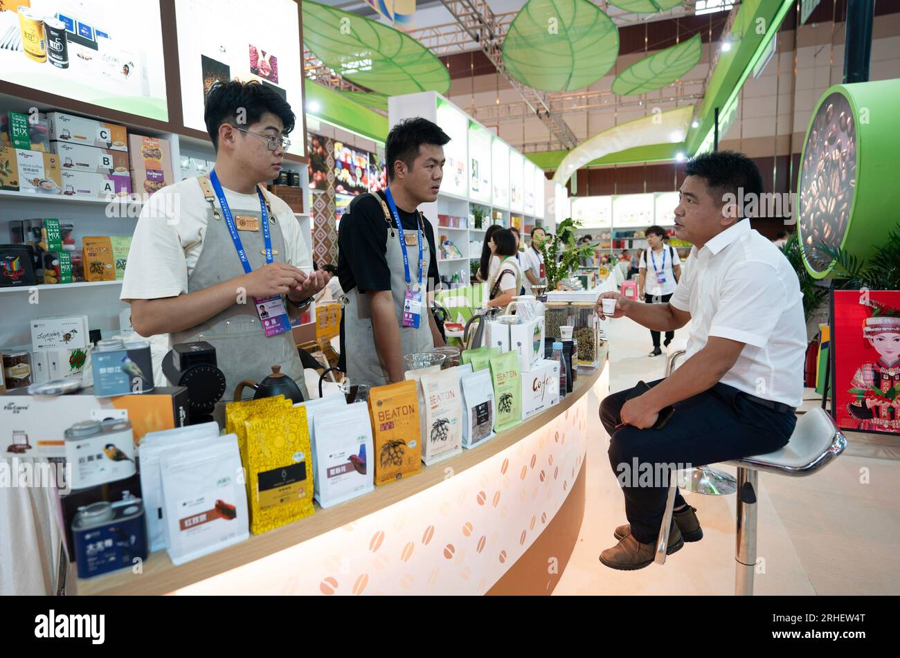 KUNMING, Aug. 16, 2023 (Xinhua) -- Exhibitors introduce coffee products at the seventh China-South Asia Expo in Kunming, southwest China's Yunnan Province, Aug. 16, 2023. The seventh China-South Asia Expo kicked off Wednesday in Kunming. More than 30,000 exhibitors, representatives and guests from 85 countries and regions, and international organizations, are expected to attend both online and offline activities during the five-day expo. The expo, themed 'Solidarity and Coordination for Common Development,' has set up 15 exhibition halls featuring diverse themes including Sout Stock Photo