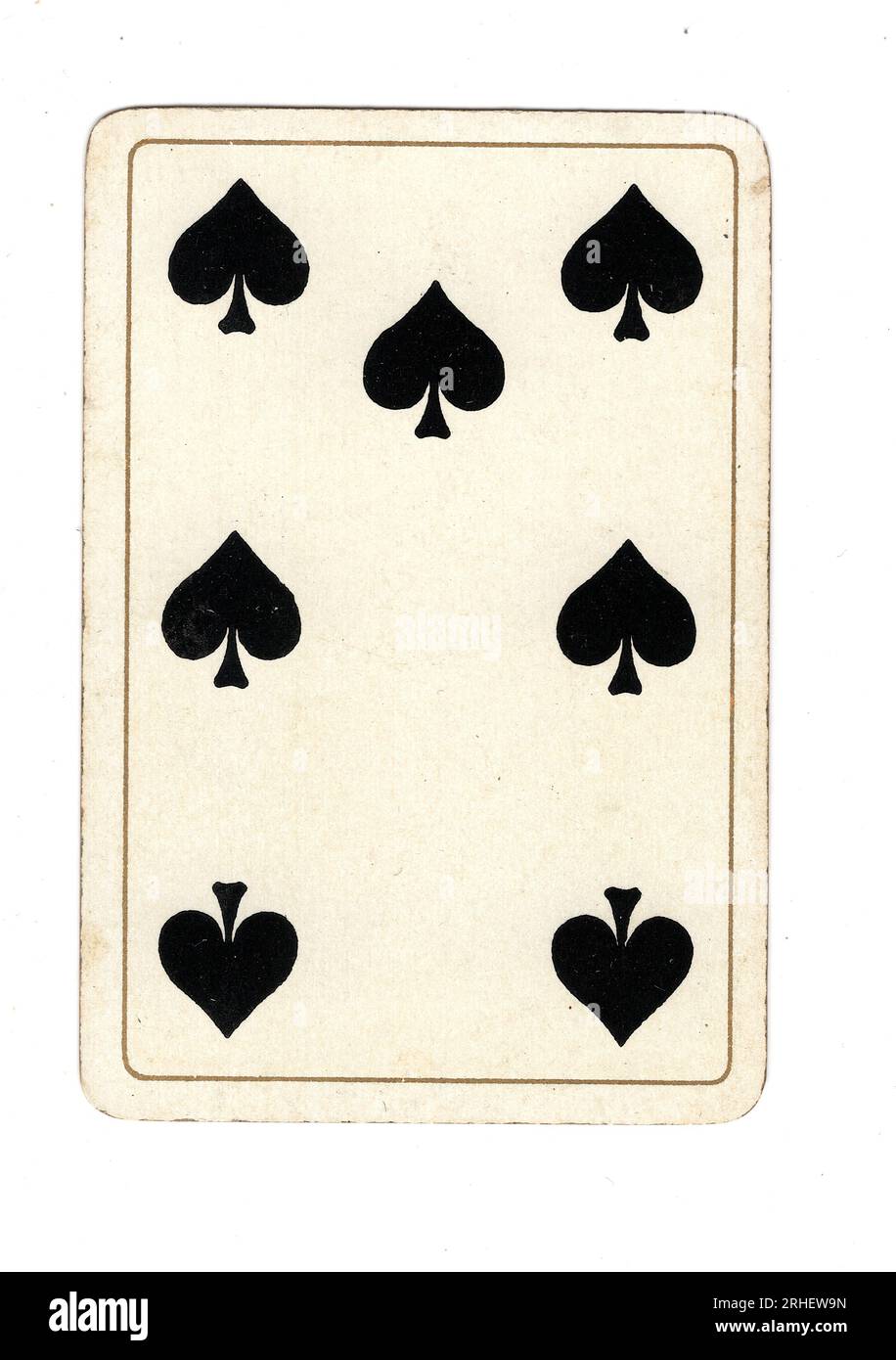 An antique seven of spades playing card on a white background Stock