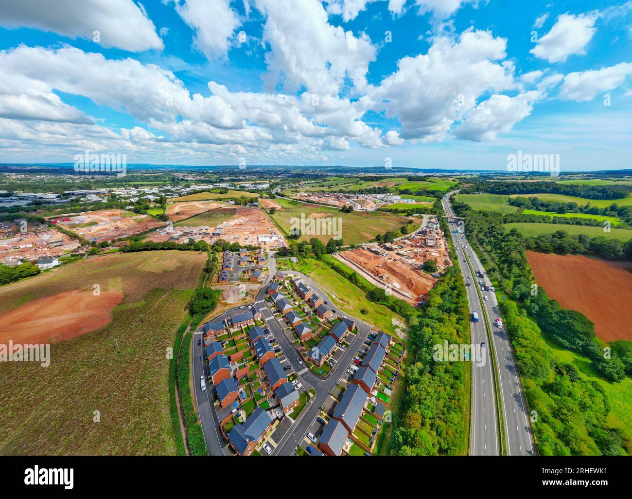 Exeter, UK. 16 August 2023. View over new housing estates in Exeter in