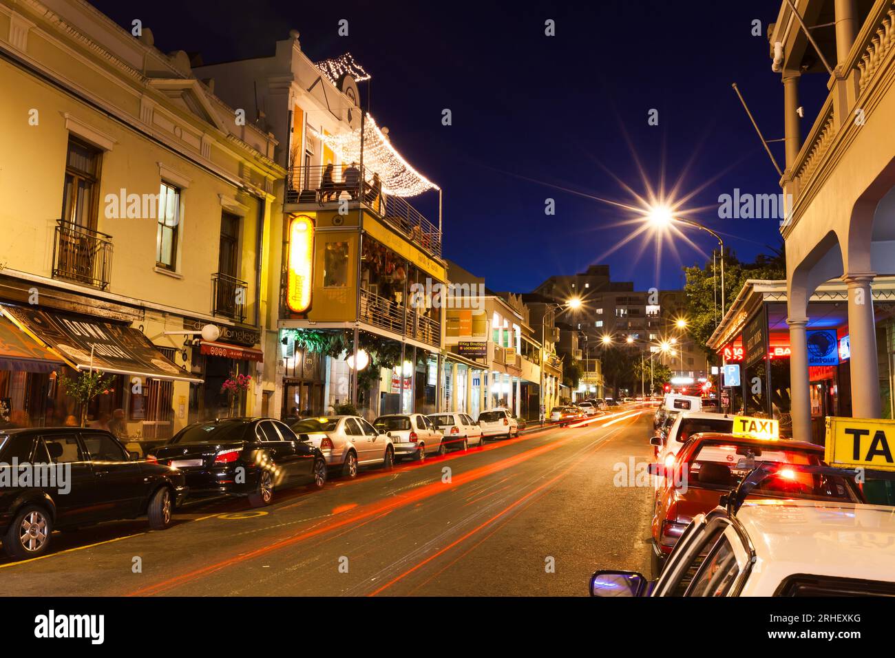 Night photograph of Long street in Cape Town South Africa with lights and buildings nightlife hustle bustle Stock Photo