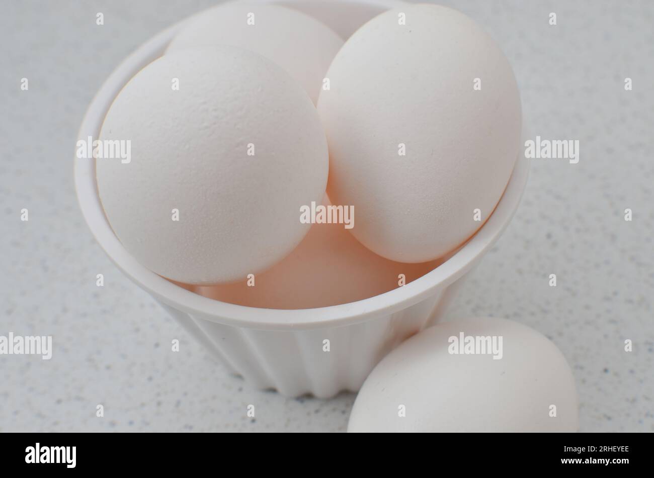 Closeup of fresh white eggs, symbol of healthy food. Perfect for a
