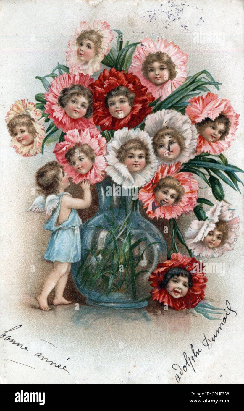 Carte de voeux de bonne annee : bouquet de fleurs avec des tetes d'enfants dans un vase - Carte postale datee 1905 Stock Photo