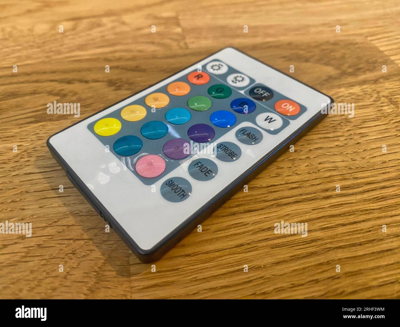 Remote control on a wooden table Stock Photo