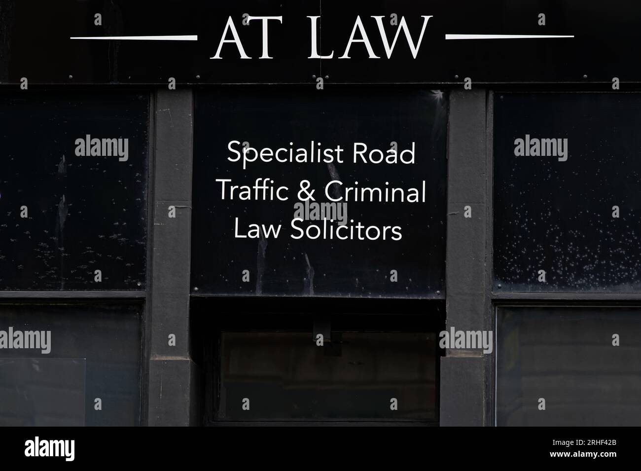 Law firm sign for traffic and criminal law solicitors Stock Photo Alamy