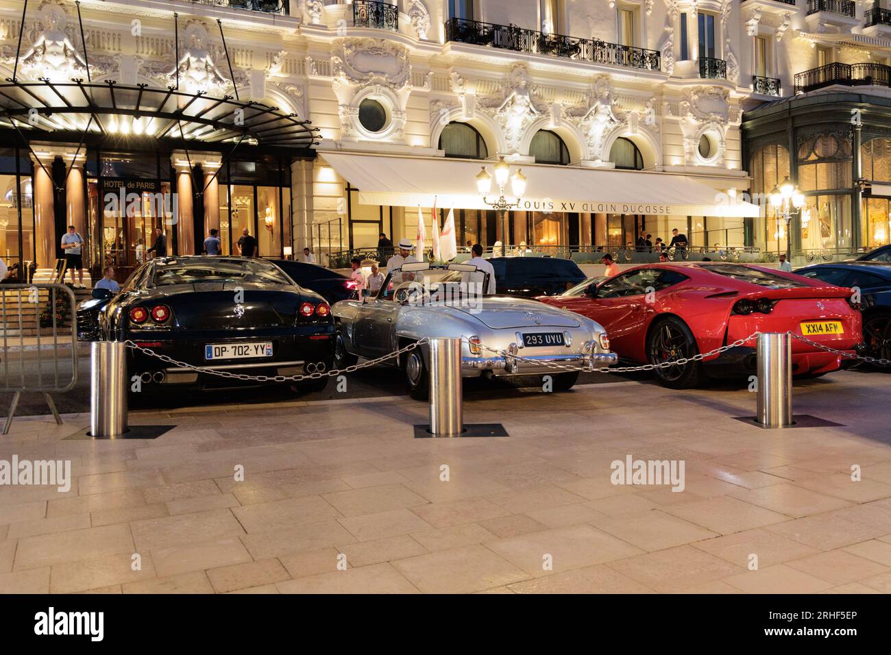 Exotic cars parked outside Hotel de Paris in Casino Square in Monte