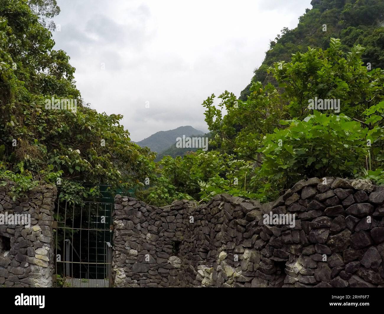 Stone wall with high mountain with beautiful view of Taroko Gorge National Park landscape in Hualien, Taiwan Stock Photo