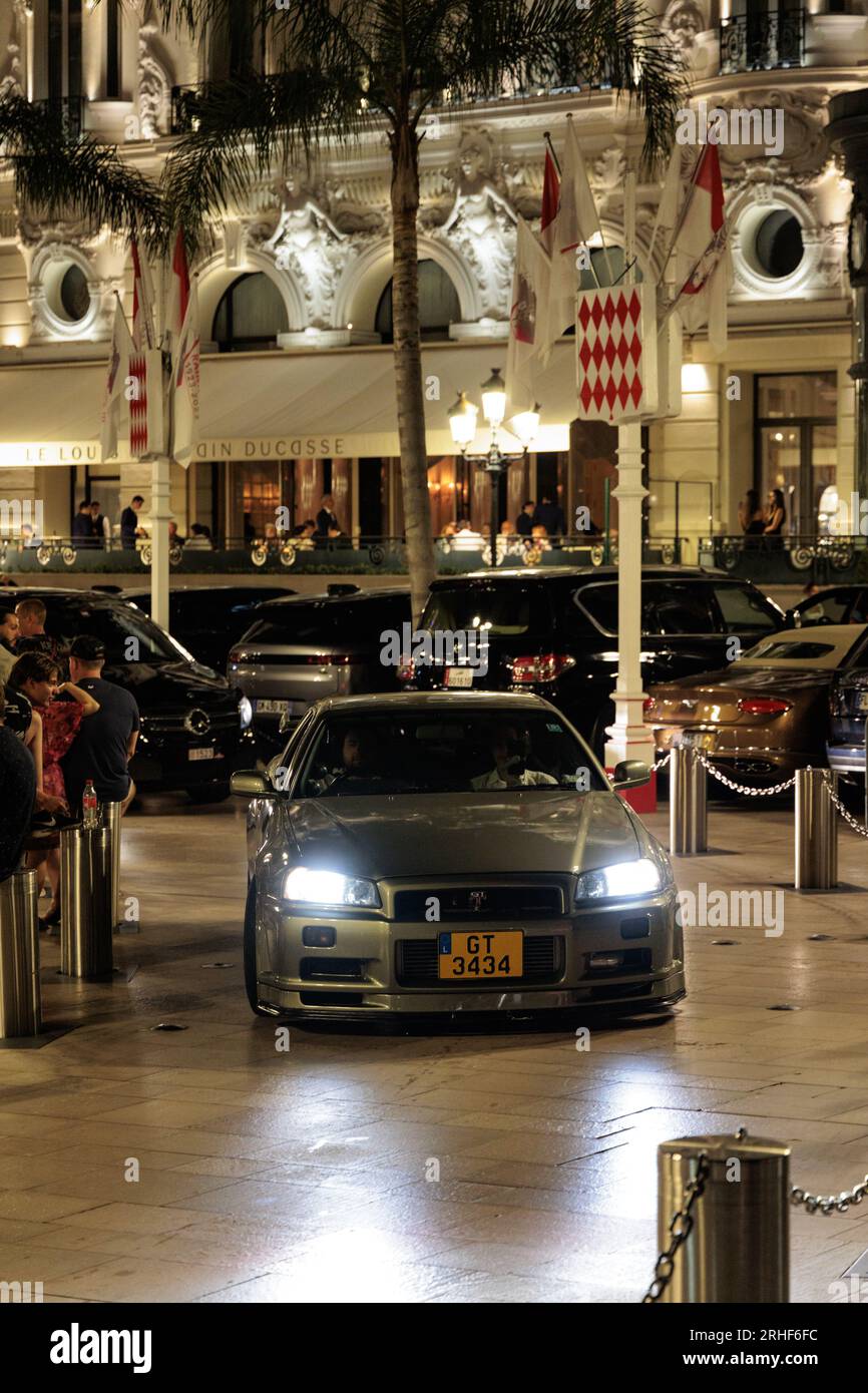 Nissan GT-R R34 driving through Casino Square in Monte Carlo, Monaco Stock Photo