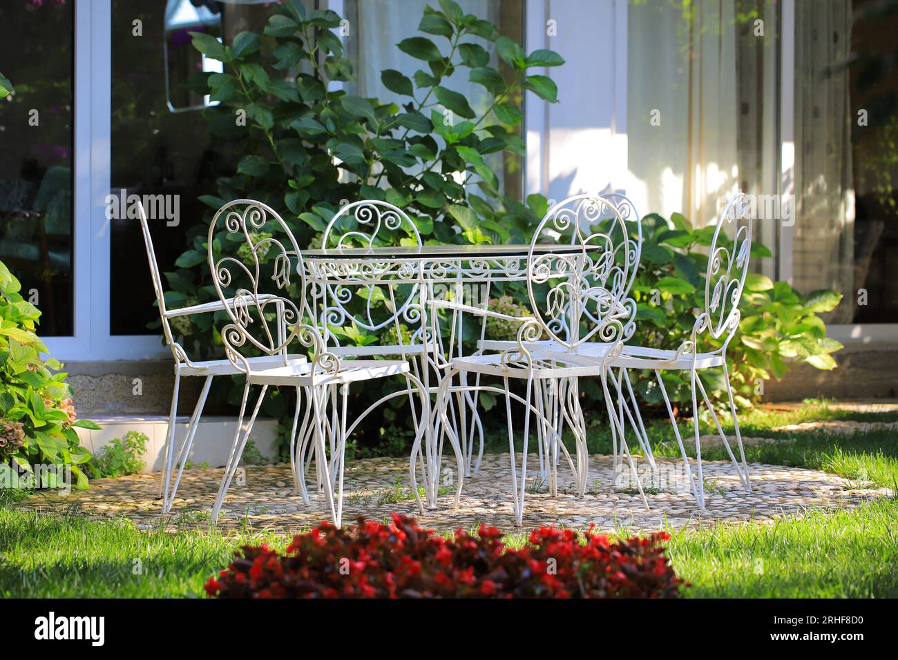 Vintage white wrought iron table with chairs outdoors Stock Photo Alamy