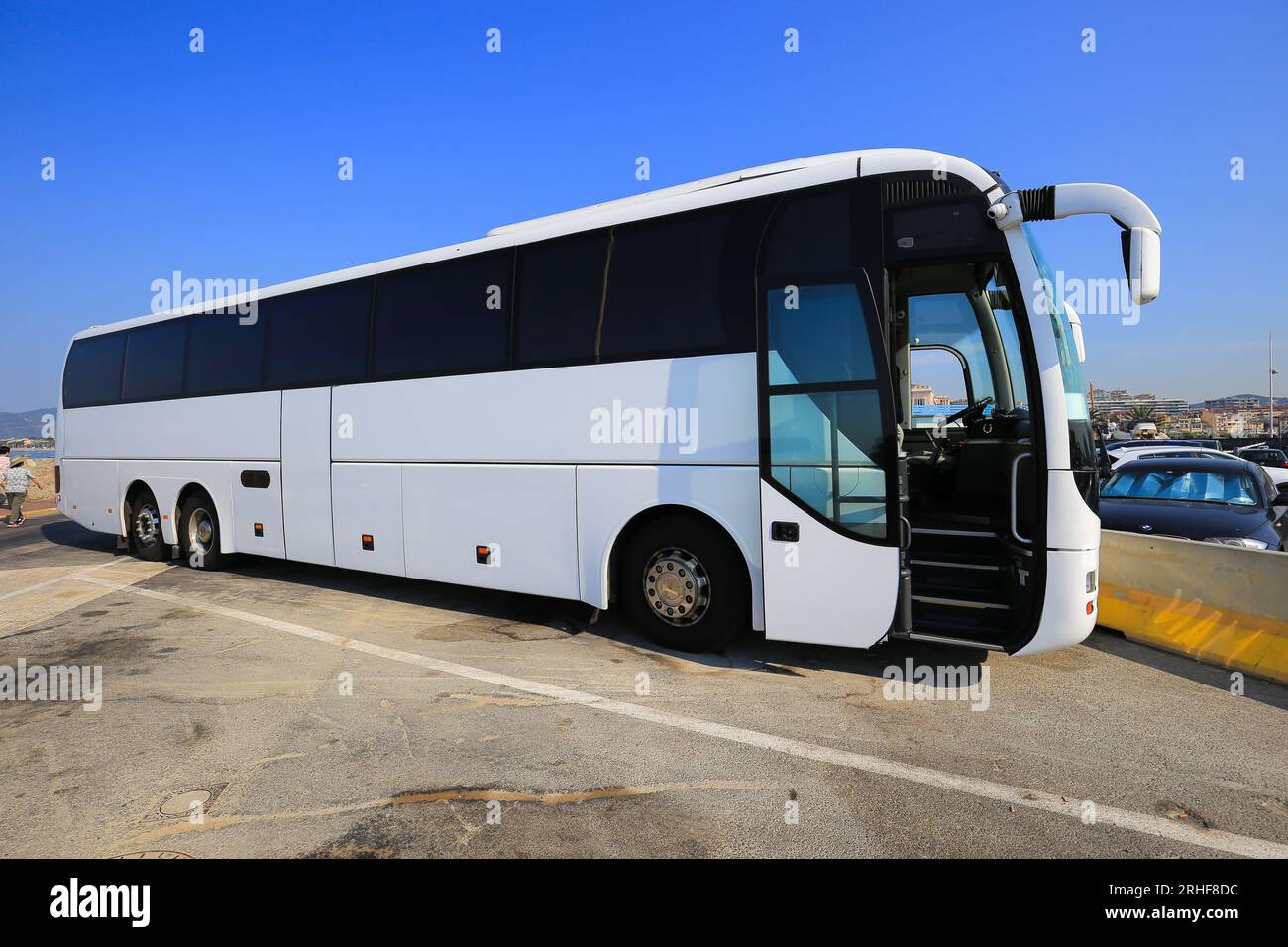 Big white passenger bus in the parking lot Stock Photo