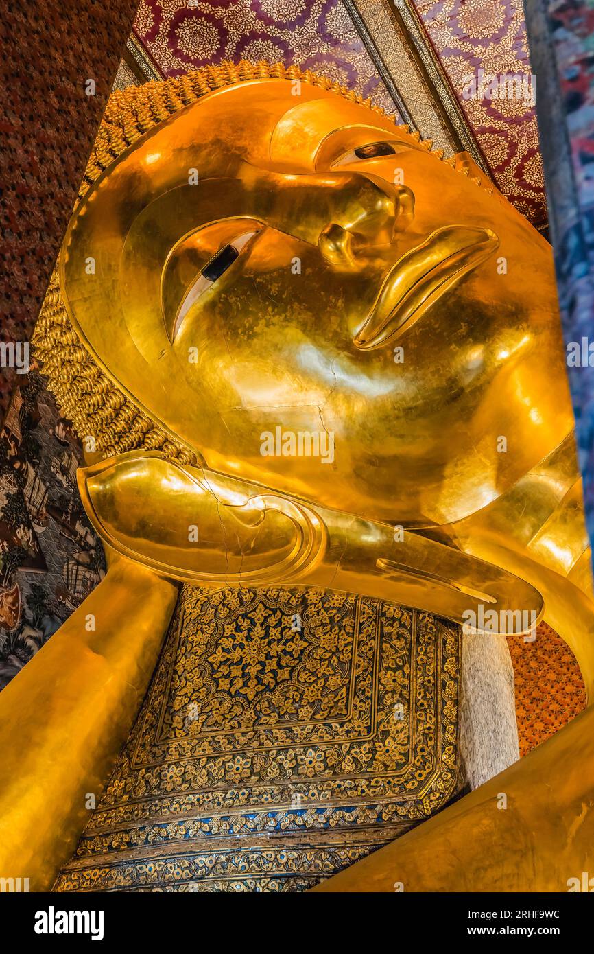 Coloful Face Reclining Buddha Wat Phra Chetuphon Wat Pho Po Temple Complex Bangkok Thailand. Buddha's face shows entrance to heaven nirvana. Goal of B Stock Photo