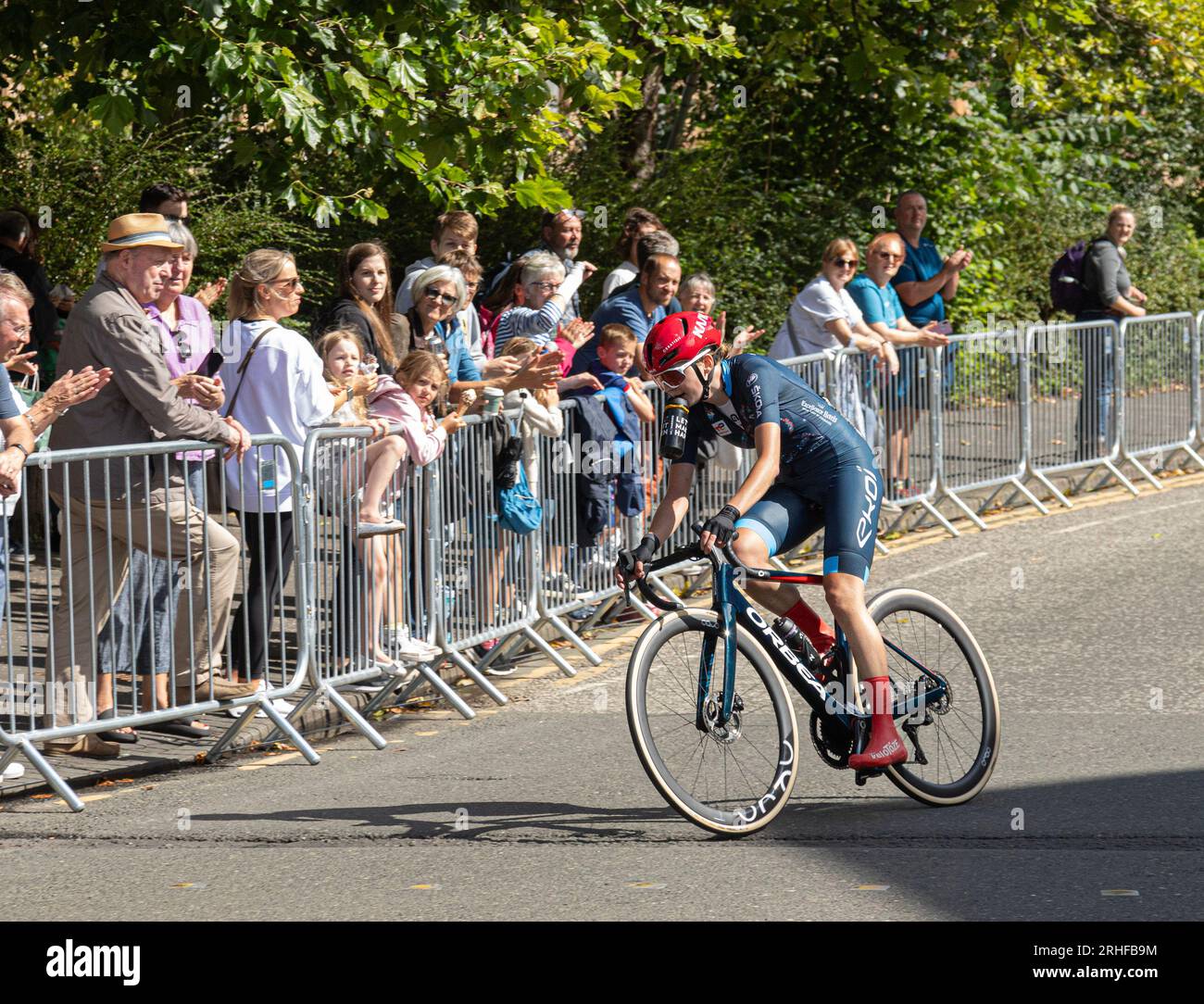 Christine Majerus of Luxembourg cycling in Glasgow during the UCI elite women's world championship road race 2023. Spectators are cheering her on. Stock Photo