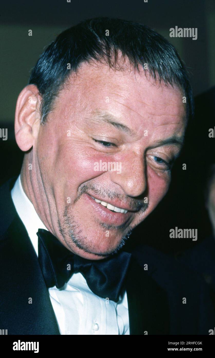 Frank Sinatra smiling with facial hair at formal event wearing a black tie,  in close-up, New York, 1970's. Photo: Oscar Abolafia/Everett Collection  (franksinatra013 Stock Photo - Alamy, image size:837x1390