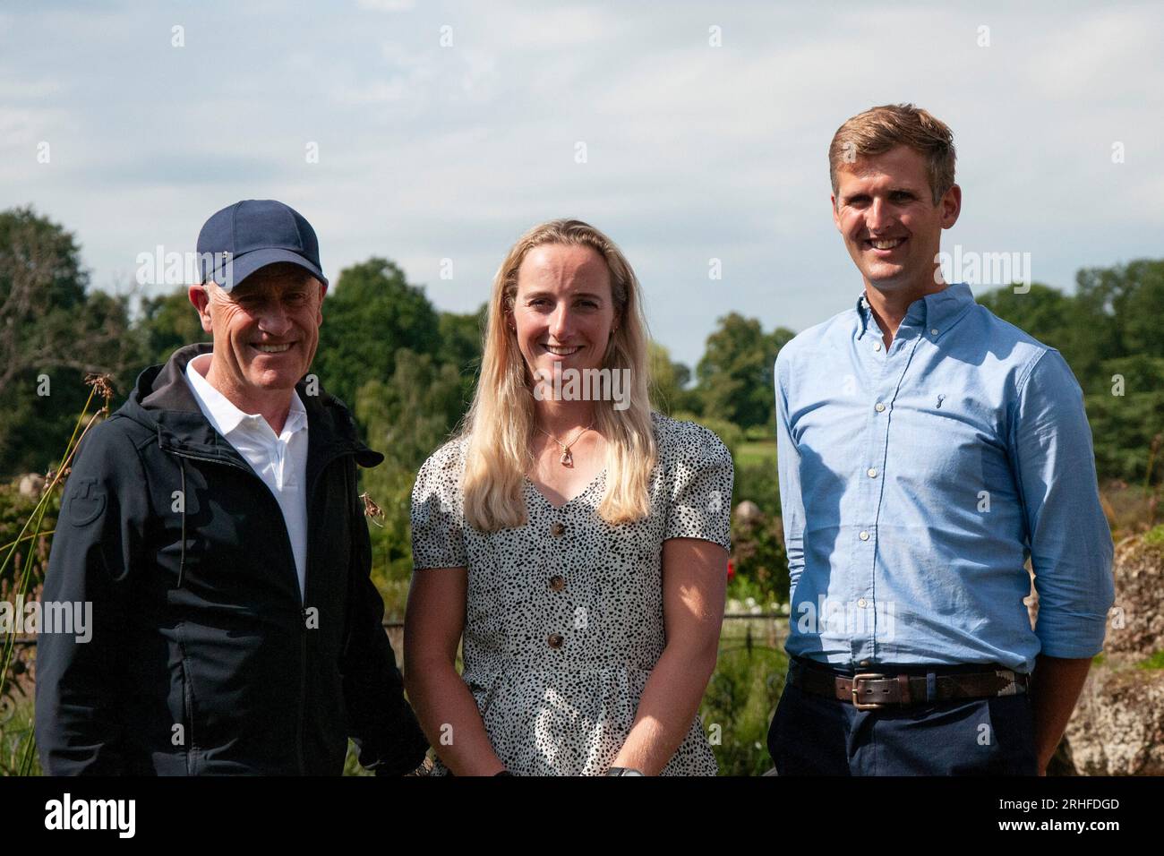 Stamford, UK. 16th Aug, 2023. Burghley Ambassador and former winner Andrew Hoy, Defender Burghley First-Timer Greta Mason and Phil Brown, who is competing at the event for the second time, pose in the Rose Garden during the pre event media day ahead of the 2023 Defender Burghley Horse Trials held in the grounds of Burghley House in Stamford, Lincolnshire, England, United Kingdom. Credit: Jonathan Clarke/Alamy Live News Stock Photo
