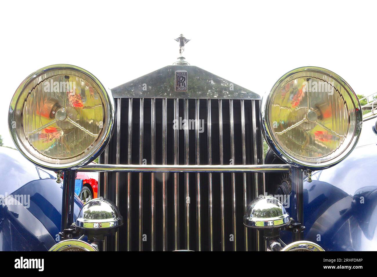 The chrome radiator grille on a 1934 Rolls Royce stands majestically like a Greek Temple. The grille slats open thromostacilly as the engine warms up. Stock Photo