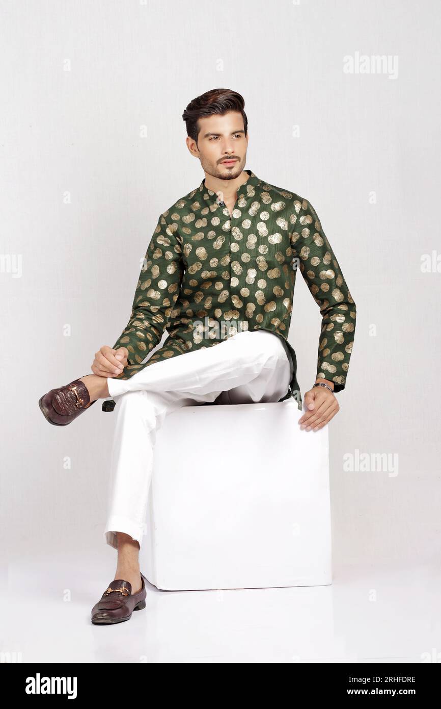 Indian male model posing in style with green traditional kurta Stock Photo