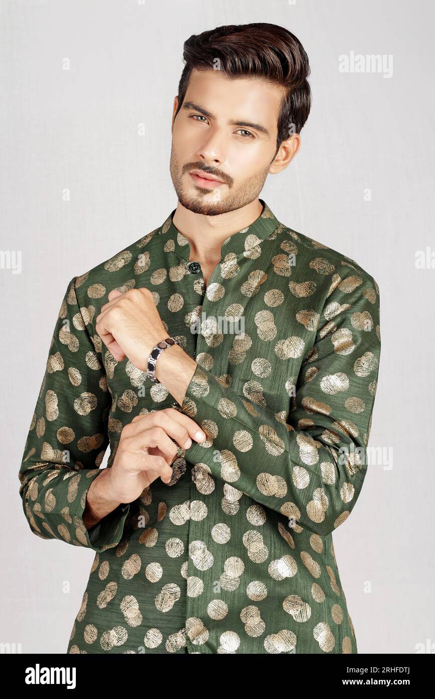Pakistani male model posing in green kurta Stock Photo