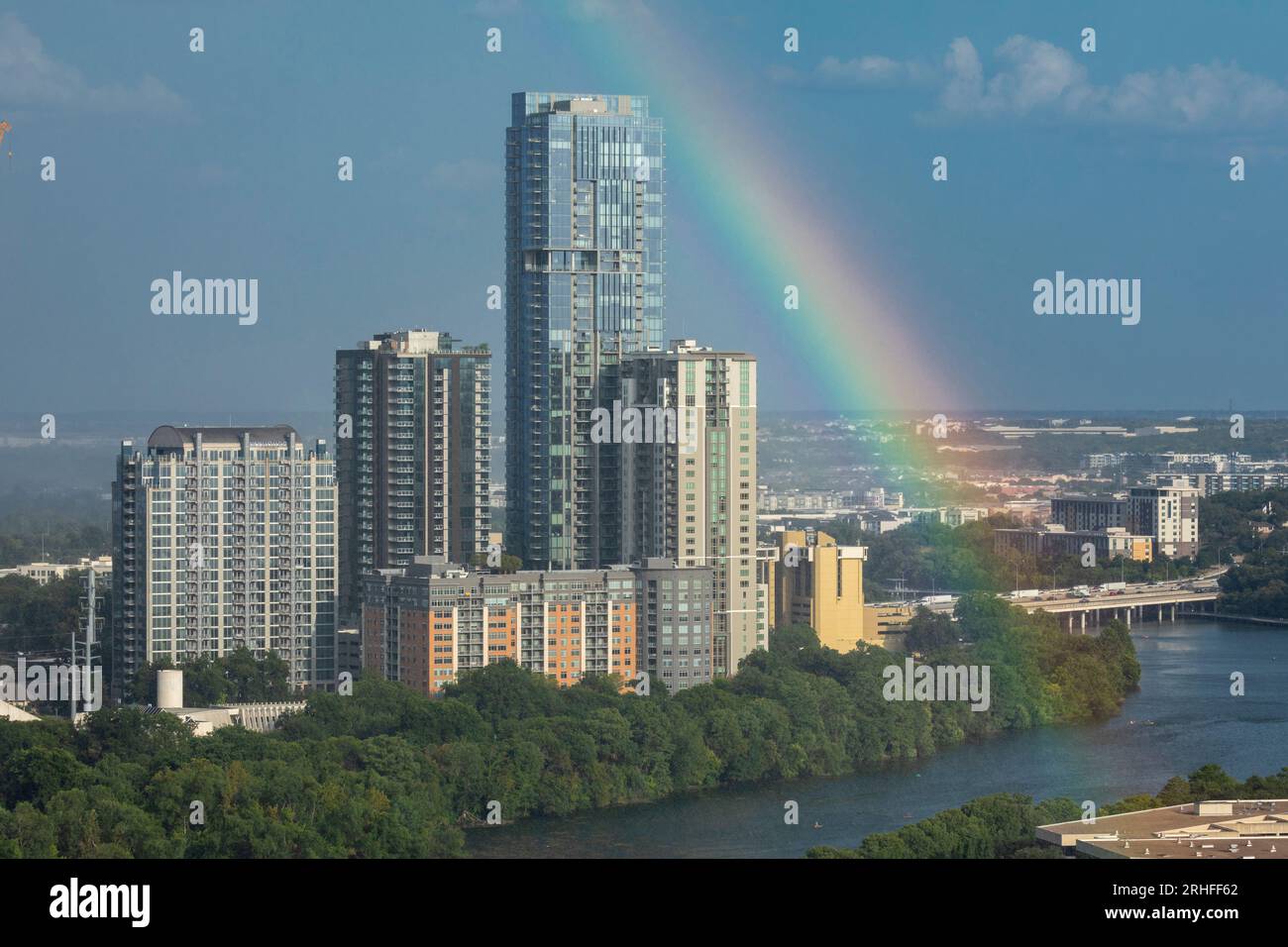 Rainbow over Rainey Street district of Austin, Texas with Ladybird Lake. Stock Photo