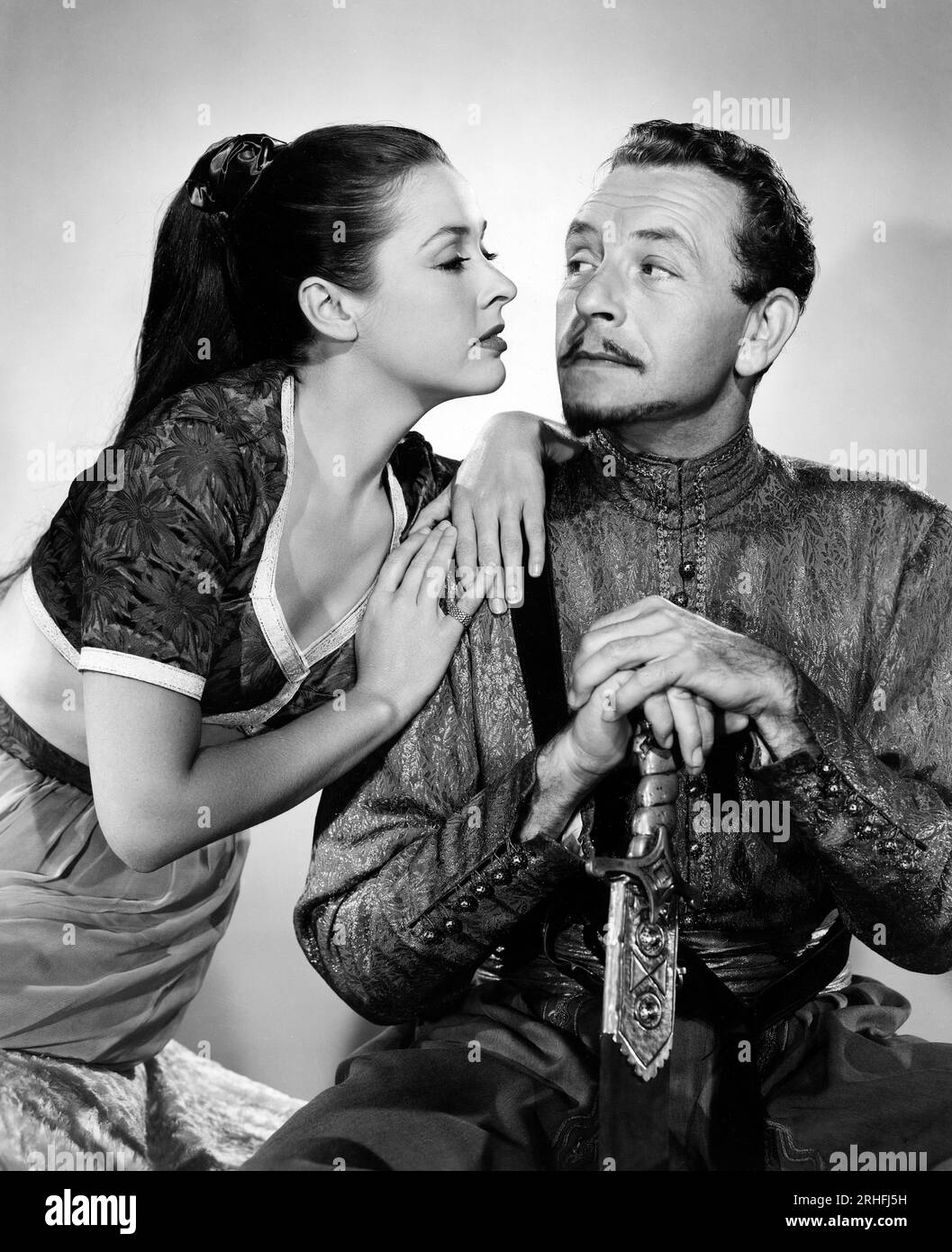 Elena Verdugo, Paul Henreid, on-set of the Film, "Thief of Damascus", Columbia Pictures, 1952 Stock Photo