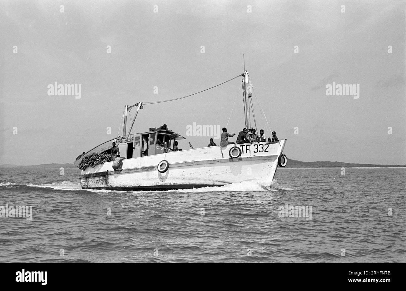 Small trawler at sea off Winneba, Ghana. Fishing among a fleet of sea