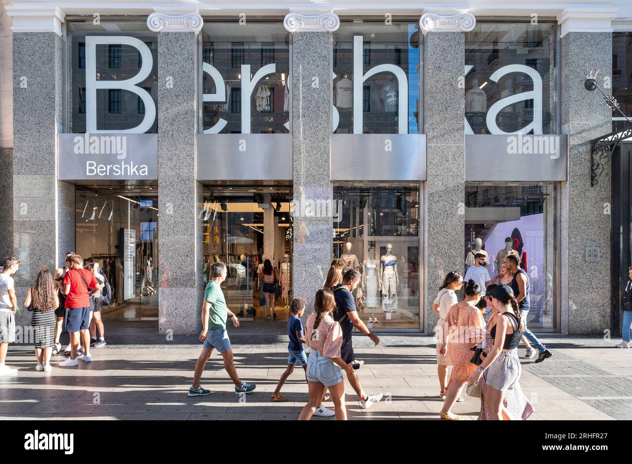 Madrid, Spain. 16th Aug, 2023. Shoppers and pedestrians walk past the Spanish fashion brand