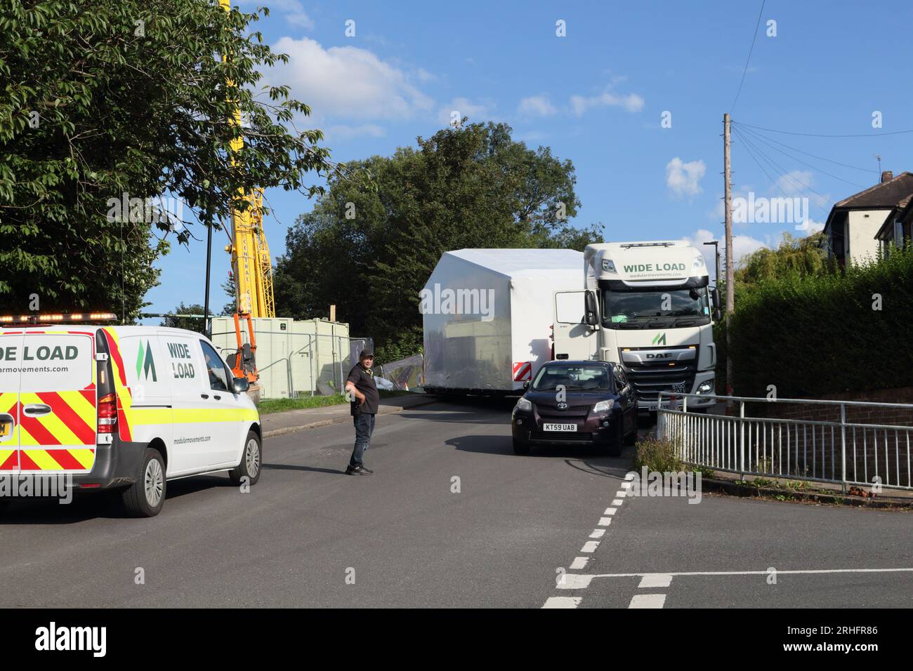 Lorry transporting prefabricated house module to building site Sheffield England UK Stock Photo