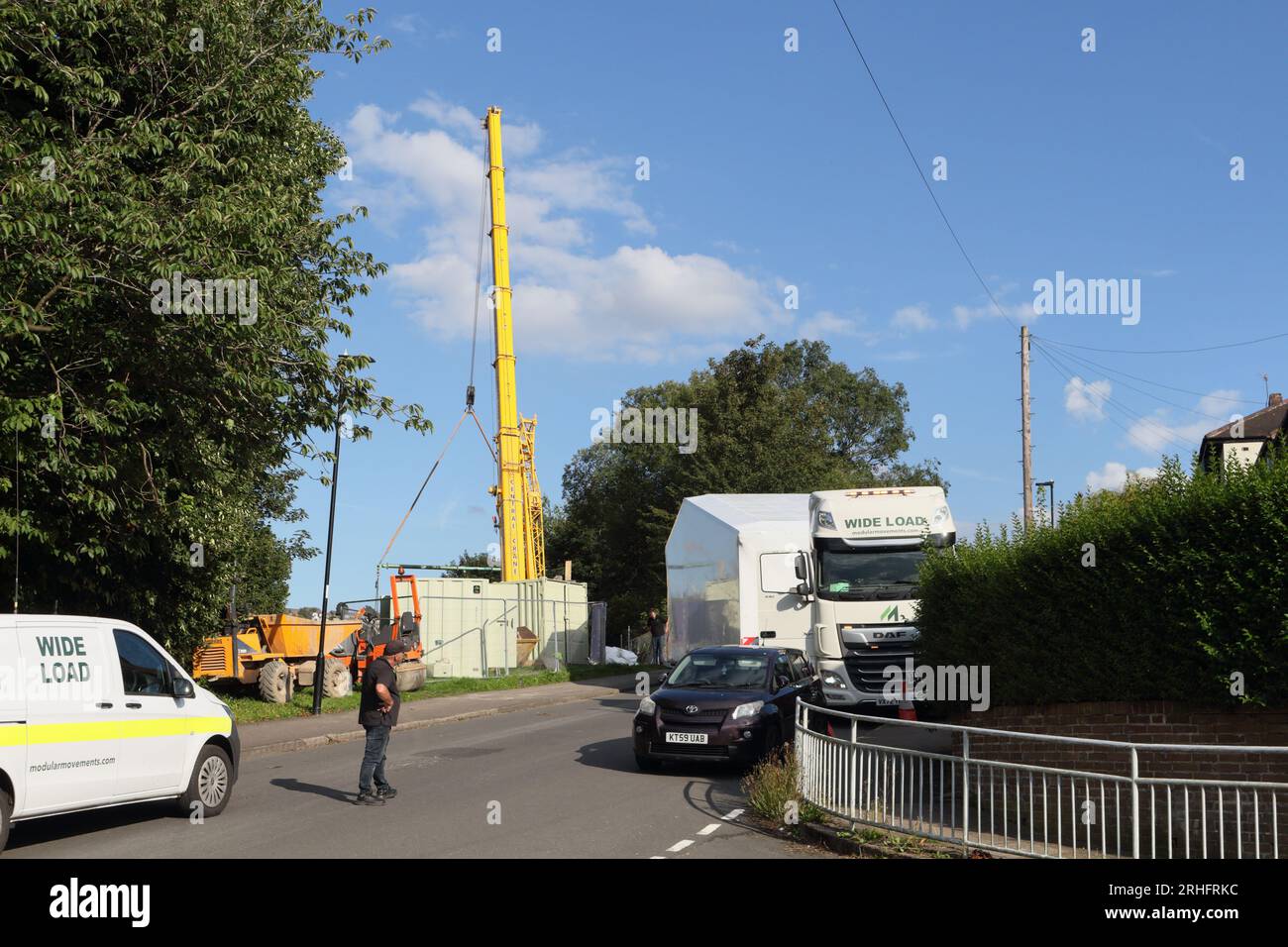 Lorry transporting prefabricated house module to building site ...
