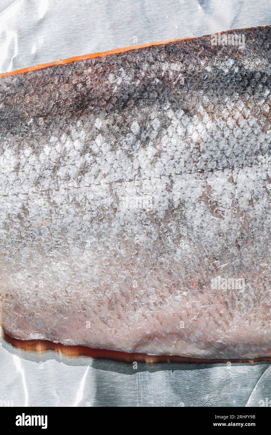metallic silver Salmon fish skin, scales ready to bake, cook on