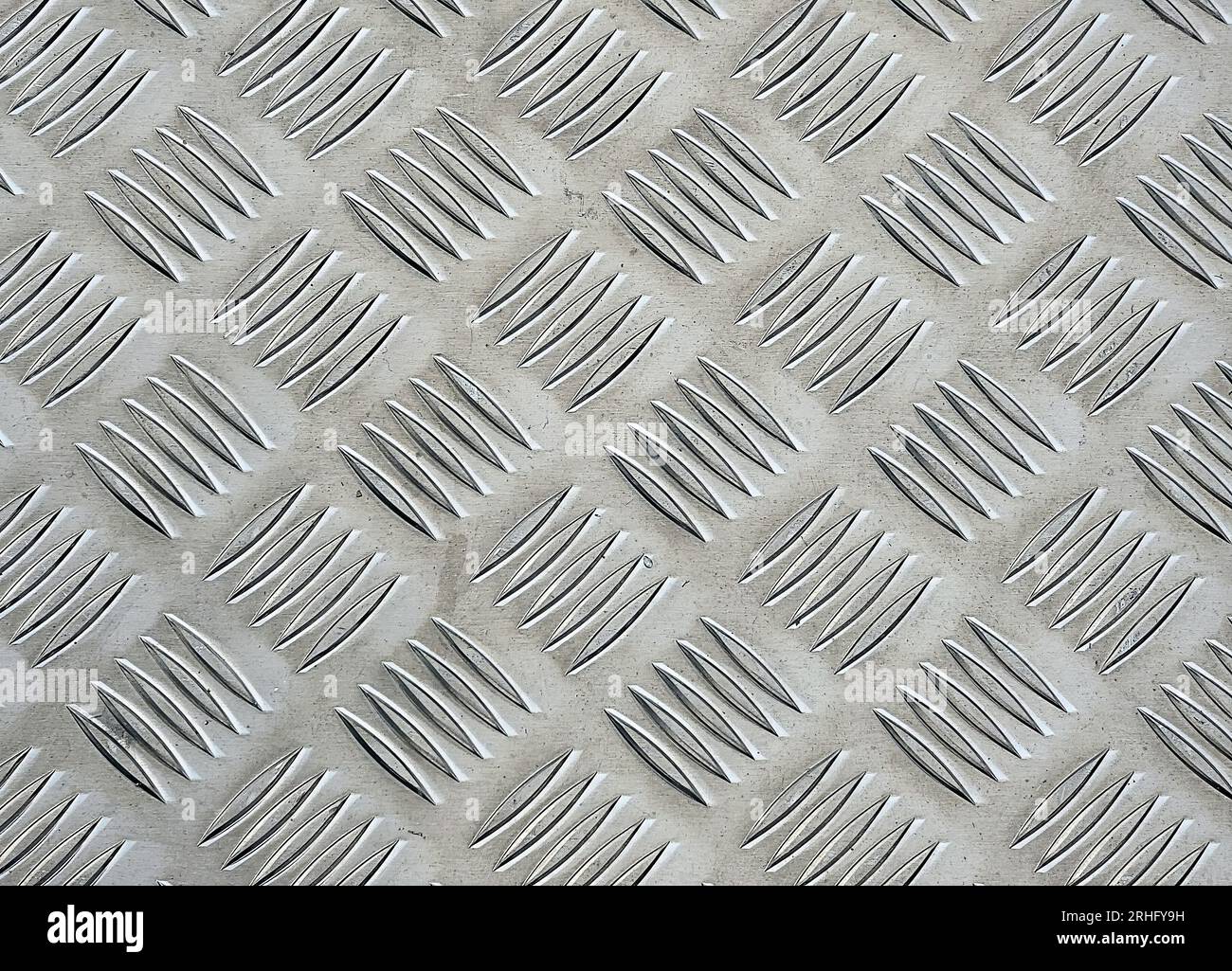 Close up of anti-slip aluminum metal with diamond pattern texture Stock Photo