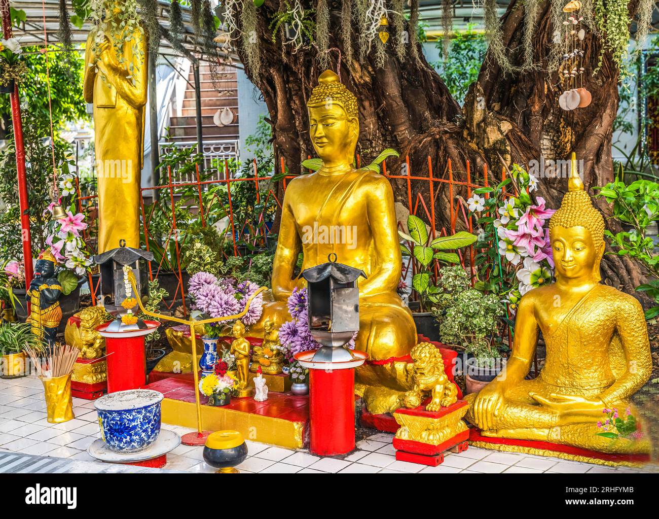 Colorful Golden Buddhas Offerings Garden Offerings Wat That Sanarun Sunthikaram Community Temple Bangkok Thailand. Small old Temple in a neighborhood Stock Photo