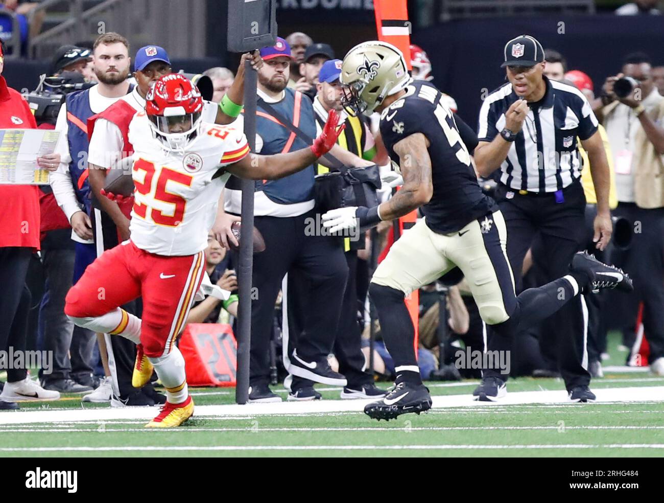 New Orleans, Louisiana, USA. 27th Dec, 2021. (left to right) New Orleans  Saints linebacker Zack Baun tries to keep a hold of Miami Dolphins running  back Duke Johnson in New Orleans, Louisiana