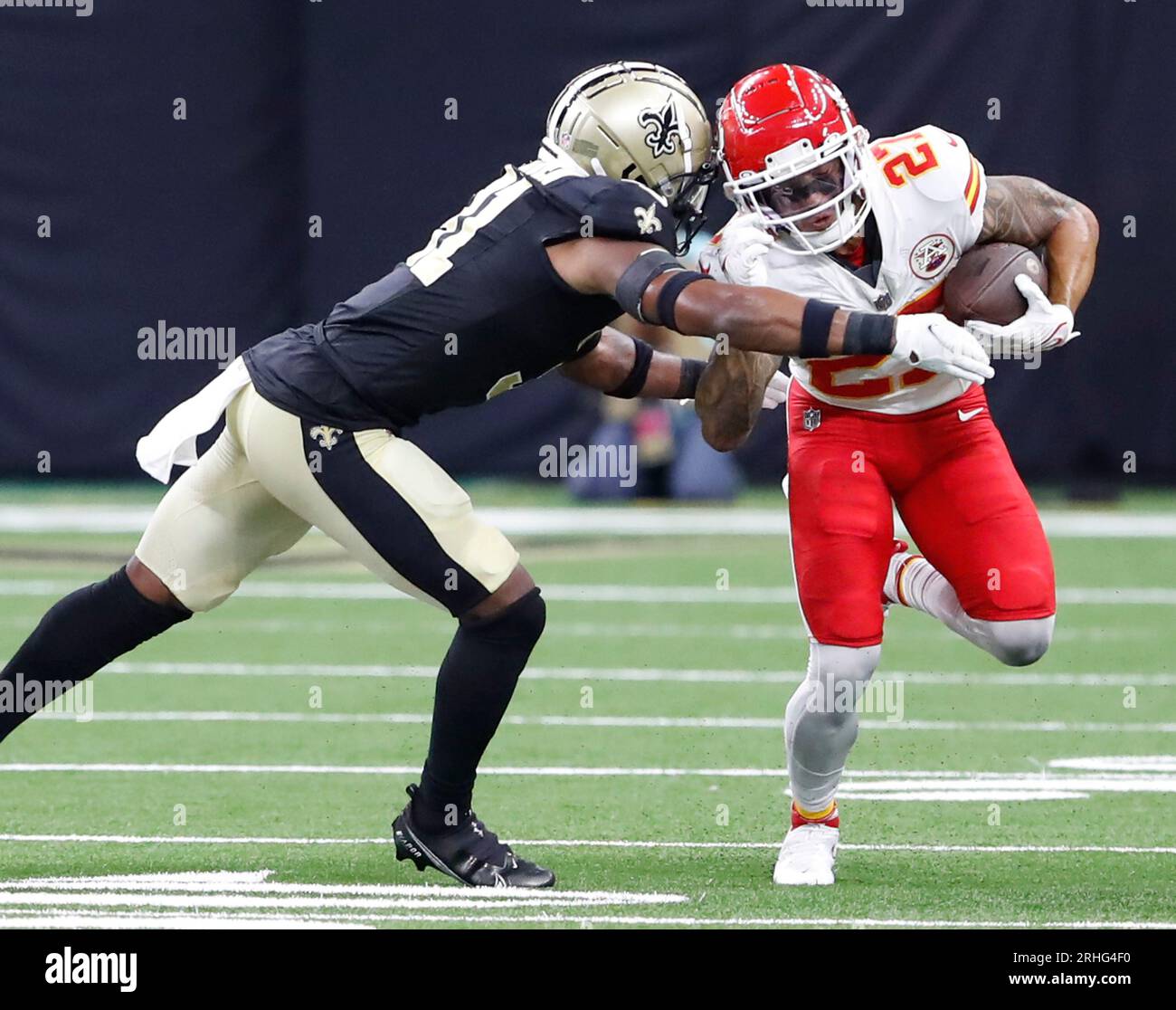 New Orleans, USA. 13th Aug, 2023. New Orleans Saints safety Jordan Howden  (31) tries to wrap up Kansas City Chiefs wide receiver Nikko Remigio (27)  during a National Football League preseason game