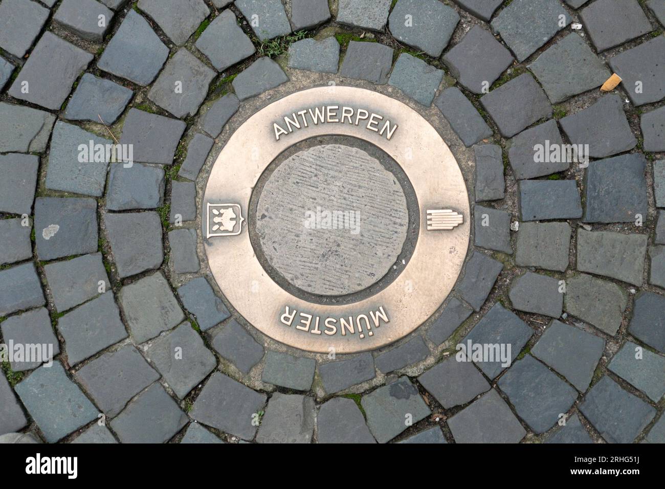 Muenster, Germany - August 5, 2023: water drain with inscription Antwerpen to honor town twinning partnership with Muenster. Stock Photo