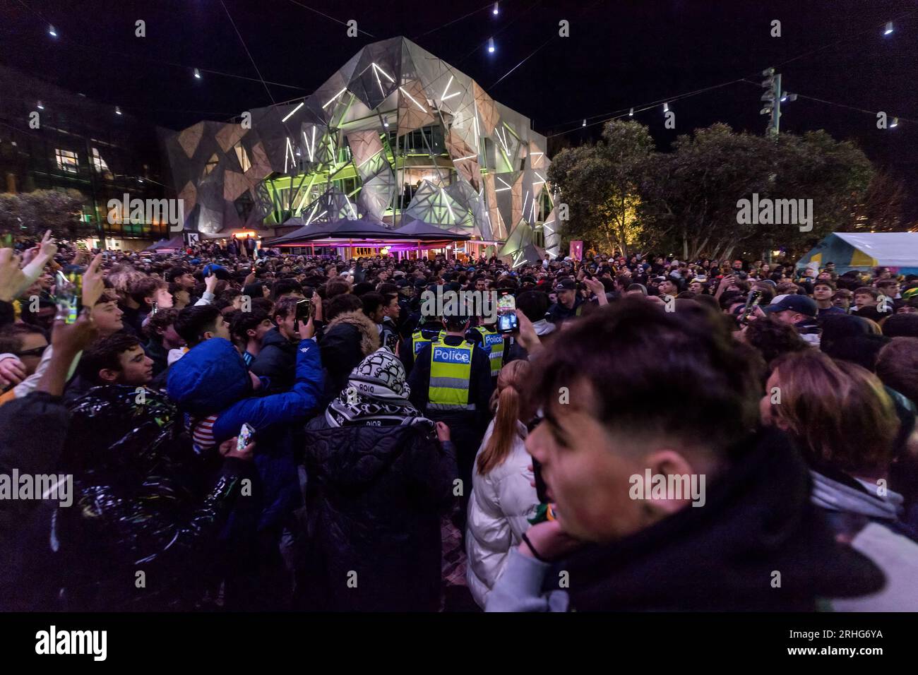 Melbourne, Australia, 16 August, 2023. Police attempt to remove trouble makers as Matildas fans watch the game at Federation Square during the Women’s World Cup semifinal in Melbourne, Australia 16 August 2023. Credit: Michael Currie/Speed Media/Alamy Live News Stock Photo